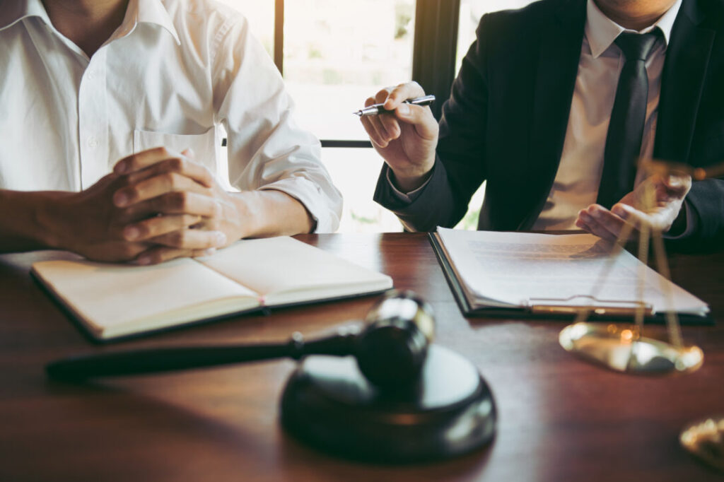 Two lawyers meeting at a table, representing the impact of design thinking training in the legal industry.