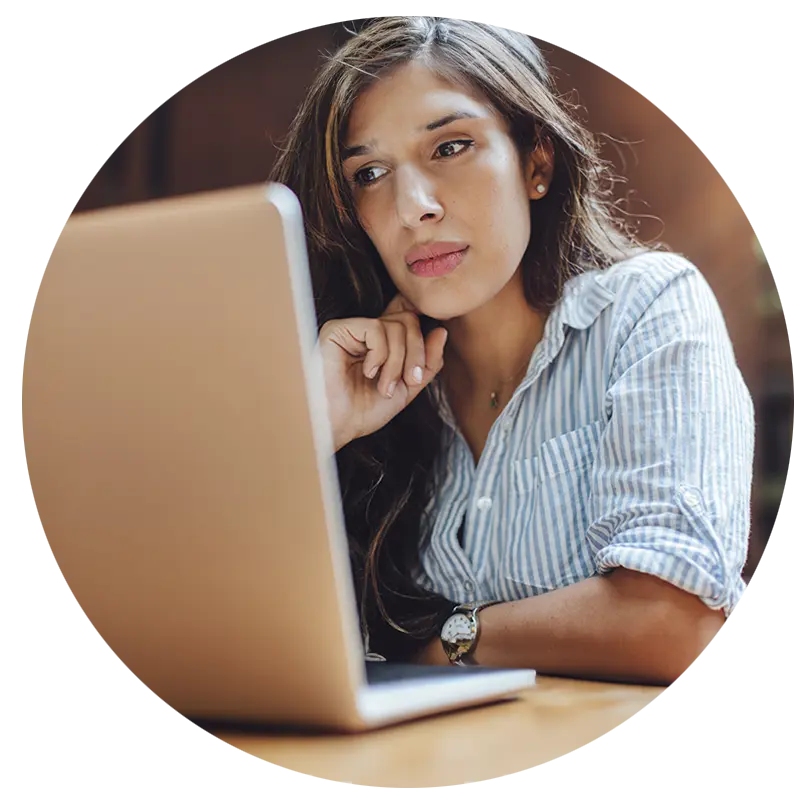 Woman working with AI on her laptop.